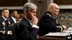 Army Secretary John M. McHugh, left, and Army Chief of Staff Gen. Raymond Odierno update members of the Senate Armed Services Committee about the deadly shooting rampage by a soldier yesterday at Fort Hood in Texas, April 3, 2014.