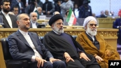 FILE - A handout picture provided by Iran's Presidency on December 23, 2023, shows, from left, Iran's Foreign Minister Hossein Amirabdollahian, President Ebrahim Raisi and Head of Iran's Judiciary Gholam Hossein Mohseni-Ejei.