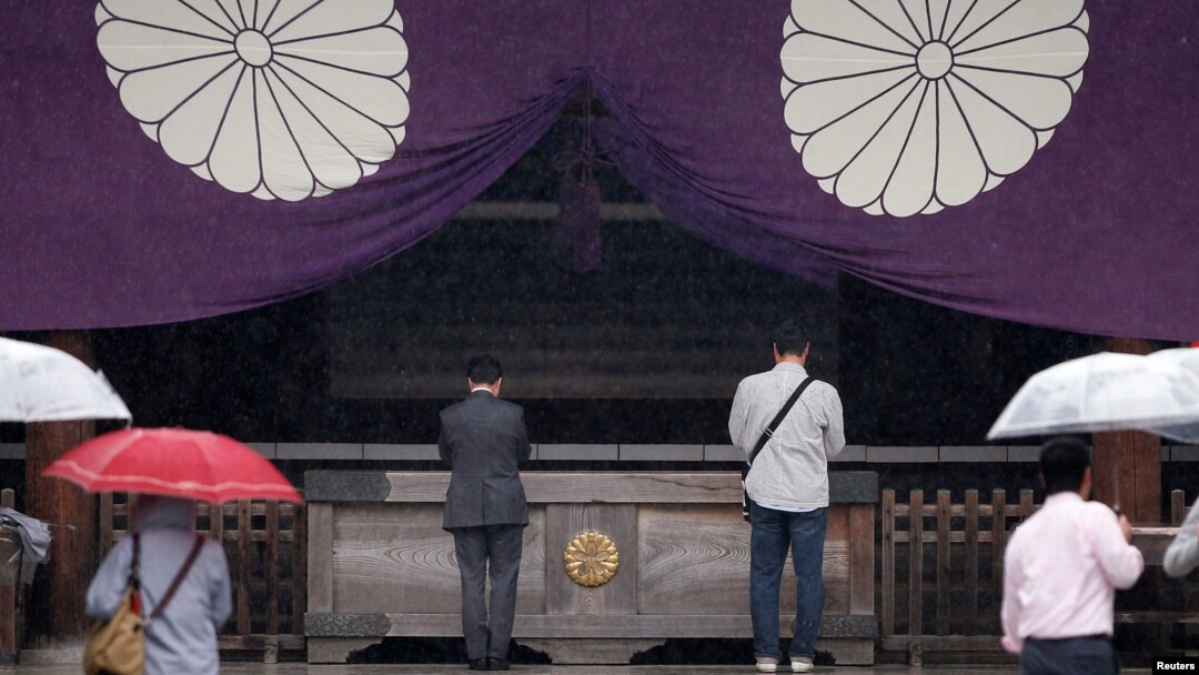 Visitors pray at the Yasukuni Shrine in Tokyo, Japan, Oct. 17, 2016.