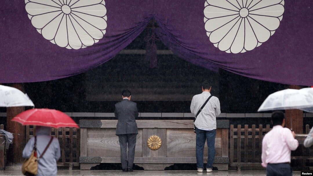 Visitors pray at the Yasukuni Shrine in Tokyo, Japan, Oct. 17, 2016.