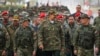 Venezuelan President Nicolas Maduro, center, walks with Defense Minister Vladimir Padrino Lopez, right, and troops during military exercises in Caracas on Jan. 22, 2025. (Venezuelan Presidency Press Office via AFP)