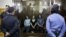 Feminist punk group Pussy Riot members, from left, Yekaterina Samutsevich, Maria Alekhina and Nadezhda Tolokonnikova sit in a glass cage at a courtroom in Moscow, Russia, Aug 17, 2012.