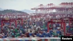 FILE - Containers are seen at the Yangshan Deep-Water Port in Shanghai.