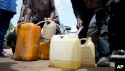 FILE: People sell black market fuel on the street in Lagos, Nigeria, Tuesday, May 30, 2023. Nigerian President Bola Tinubu has scrapped a decadeslong government-funded subsidy that has helped reduce the price of fuel, leading to a disruption in the longtime petrol black market.