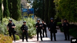 FILE - Police on the UCLA campus after nighttime clashes between pro-Israel and pro-Palestinian groups, May 1, 2024, in Los Angeles. 