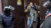 Ukrainian Security Service officers detain former Georgian president Mikheil Saakashvili at the entrance of his apartment building in Kyiv, Ukraine, Dec. 5, 2017. 