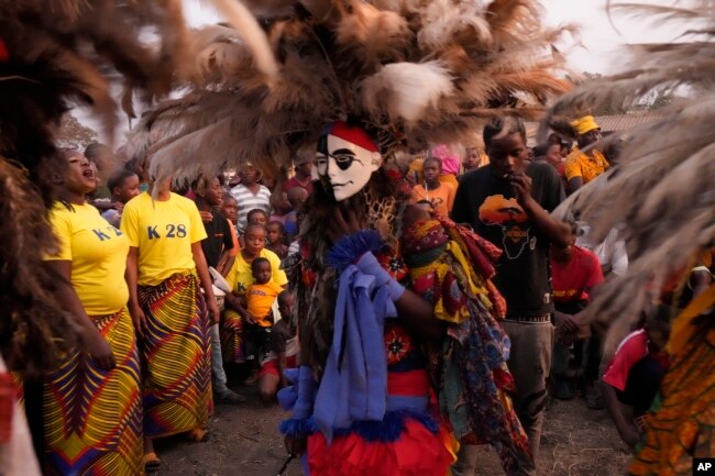 Gule Wamkulu dance secretive society members in masks and colorful outfits perform their ritual dance in Harare, Zimbabwe on October 23, 2022.(AP Photo/Tsvangirayi Mukwazhi)