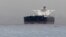 Malta-flagged Iranian crude oil supertanker "Delvar" is seen anchored off Singapore on March 1, 2012. Western trade sanctions against Iran are strangling its oil exports even before they go into effect.