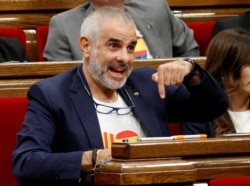 FILE - Carlos Carrizosa of Ciudadanos party speaks at the Parliament of Catalonia after Spain's Supreme Court jailed nine separatist leaders, triggering violent protests in the region, in Barcelona, Spain, October 17, 2019.