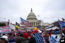 FILE - Insurrectionists loyal to President Donald Trump breach the U.S. Capitol in Washington on January 6, 2021.