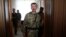 Pro-Russian separatist commander Igor Strelkov leaves after a news conference in the eastern Ukrainian city of Donetsk, July 10, 2014. 
