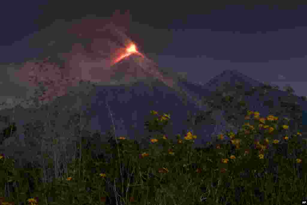 The Volcan de Fuego, or Volcano of Fire, spews hot molten lava from its crater in Escuintla, Guatemala.