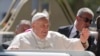 Pope Francis waves from the car, in Dili, East Timor, Monday, Sept. 9, 2024.