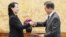 North Korean leader Kim Jong Un's sister Kim Yo Jong hands a signed letter from Kim Jong Un to South Korea's President Moon Jae-in during their meeting at the presidential Blue House in Seoul, Feb. 10, 2018.
