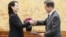 North Korean leader Kim Jong Un's sister Kim Yo Jong hands an autographed letter from Kim Jong Un to South Korea's President Moon Jae-in during their meeting at the presidential Blue House in Seoul, Feb. 10, 2018.