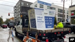 A replacement ballot drop box is unloaded in Portland, Oregon, Oct. 28, 2024.