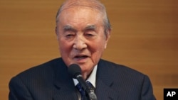 FILE - Former Japanese Prime Minister Yasuhiro Nakasone delivers a speech during the annual meeting on Japan's constitution reform in Tokyo, May 1, 2015.