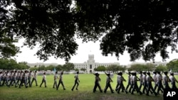 FILE - In this April 16, 2015 file photo, cadets practice for their weekly parade on the campus of The Citadel in Charleston, S.C. The New York Times reported the school moved to spend $50,000 for the right to use its rankings online, in print and on television.