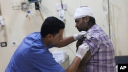 A man injured in the shelling from Syrian government forces is treated in a hospital in Idlib, Syria, on Oct. 6, 2023.