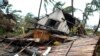 FILE — A house lays in ruins in Mananjary, Madagascar, on February 10, 2022 after it was damaged by Cyclone Batsirai. 