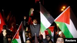 Pro-Palestinian demonstrators shout slogans during a protest against Israel near the Israeli Consulate in Istanbul, Turkey, late May 9, 2021.