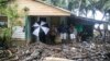 A home is surrounded by debris brought in by Hurricane Irma in Nagua, Dominican Republic, Sept. 7, 2017.