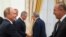 Russian President Vladimir Putin, left, shakes hands with Turkish Foreign Minister Mevlut Cavusoglu during their meeting in the Kremlin in Moscow, Russia, Aug. 24, 2018. 