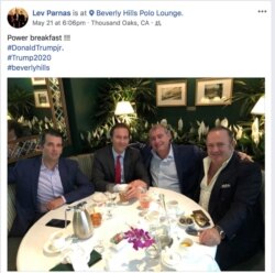 Donald Trump Jr. is seen at a meal with, left to right, Trump campaign fundraiser Tommy Hicks Jr., Ukrainian-American businessman Lev Parnas and Belarus-born businessman Igor Fruman in a 2018 screen capture from Parnas' social media account made by the Campaign Legal Center and released after Parnas and Fruman's arrests on federal campaign finance violation charges in Washington, Oct. 10, 2019.