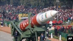 FILE - A model of a anti-satellite weapon from Defense Research and Developing Organization rolls out during Republic Day parade in New Delhi, India, Jan. 26, 2020.