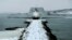 FILE - The future USS Michael Monsoor passes Spring Point Light in South Portland, Maine, after performing offshore sea trials, Jan. 17, 2018. 