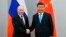  Tổng thống Nga Vladimir Putin (trái) bắt tay Chủ tịch Trung Quốc Tập Cận Bình trước cuộc hội đàm bên lề Hội nghị thượng đỉnh BRICS lần thứ 11, tại Brasilia, Brazil, vào ngày 12/11/2019.  Ông Putin hôm 22/2 cho biết ông Tập sẽ sớm thăm Moscow.