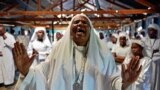 A woman screams during a special prayer for the victims of the Westgate Mall massacre at the Legio Maria African Mission church in Nairobi, Kenya. 