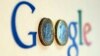 An illustration picture shows a Google logo with two one Euro coins, taken in Munich, Jan. 15, 2013. 
