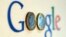 An illustration picture shows a Google logo with two one Euro coins, taken in Munich, Jan. 15, 2013. 