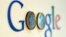 An illustration picture shows a Google logo with two one Euro coins, taken in Munich, Jan. 15, 2013. 