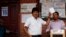 Bolivia's President Evo Morales, left, poses for a picture before casting his vote in Villa 14 de Septiembre, in the Chapare region, Bolivia, Oct. 20, 2019. 