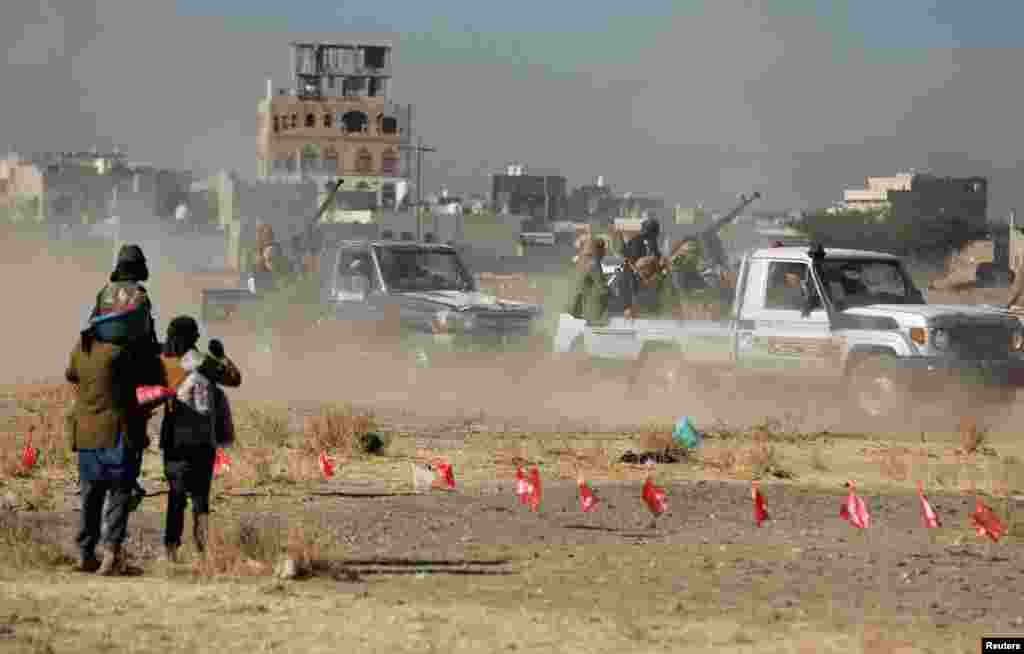 Houthi-aligned armed tribesmen arrive at a gathering to show support to Palestinians in the Gaza Strip and defiance to Israel and U.S.-led coalition, in the northern outskirts of Sanaa, Yemen.