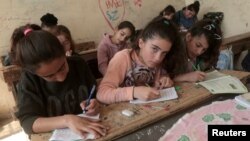Kurdish students attend class at a school in Qamishli, Syria, March 11, 2019. (REUTERS/Issam Abdallah)