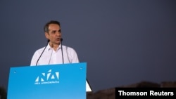 Main opposition New Democracy conservative party leader Mitsotakis addresses supporters during a pre-election rally in Athens.