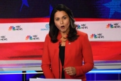 FILE - Democratic presidential hopeful U.S. Representative from Hawaii Tulsi Gabbard speaks during the first Democratic primary debate of the 2020 presidential campaign at the Adrienne Arsht Center for the Performing Arts in Miami, June 26, 2019.