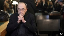 Cardinal Philippe Barbarin waits for the start of his trial at the Lyon courthouse, central France, Jan. 7, 2019.