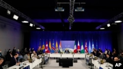 World leaders attend a meeting on the "Build Back Better World" initiative at the COP26 U.N. Climate Summit, Nov. 2, 2021, in Glasgow, Scotland. 