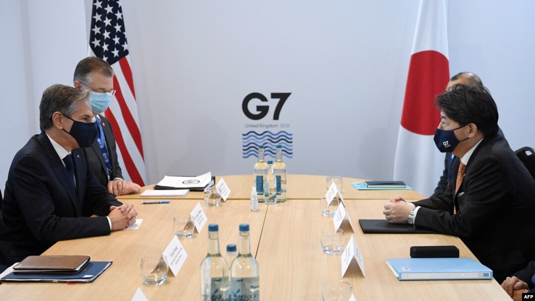 FILE - U.S. Secretary of State Antony Blinken, left, and Japan's Foreign Minister Yoshimasa Hayashi, right, hold a bilateral meeting at the G-7 foreign ministers summit in Liverpool, northwest England, Dec. 11, 2021. 