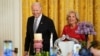 U.S. President Joe Biden and first lady Jill Biden arrive for a reception celebrating Nowruz in the East Room at the White House in Washington, March 20, 2023. 