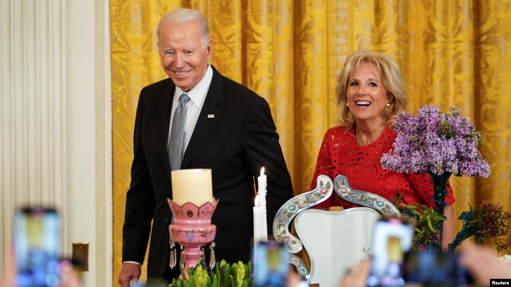 U.S. President Joe Biden and first lady Jill Biden arrive for a reception celebrating Nowruz in the East Room at the White House in Washington, March 20, 2023. 