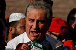 FILE - Pakistan's Foreign Minister Shah Mahmood Qureshi speaks in Multan, Pakistan, Oct. 11, 2019, days ahead of a Financial Action Task Force meeting in Paris. Pakistan was trying to avoid terrorism-financing sanctions. As of Feb. 21, 2020, it remains on the FATF "gray list" of nations with inadequate mechanisms to curb funding sources to terrorist groups.