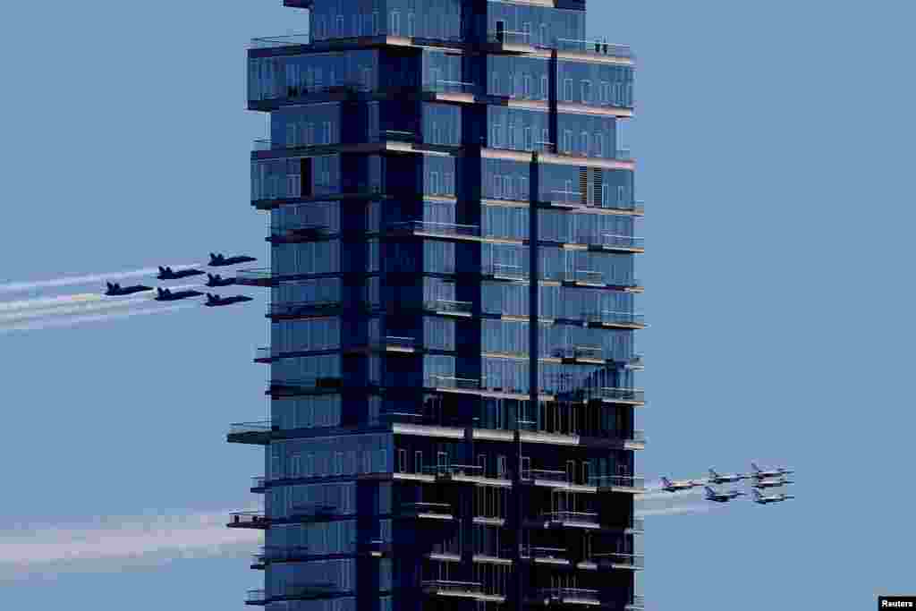 U.S. Navy Blue Angels and U.S. Air Force Thunderbirds demonstration teams take part in a midday flyover over New York City to honor first responders and essential workers during the COVID-19 outbreak, April 28, 2020.