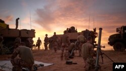 FILE - Soldiers from the French Army set up a Temporary Operative Advanced Base during the Bourgou IV operation in the area of the three borders between Mali, Burkina Faso and Niger, Nov. 9,2019.