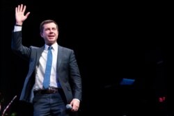 Democratic presidential candidate Pete Buttigieg waves to the crowd during a town hall meeting, in Concord, New Hampshire, Feb. 5, 2020.