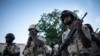 FILE - Soldiers perform their duties at the Multinational Joint Task Force base in Mora, Cameroon, Sept. 28, 2018. 